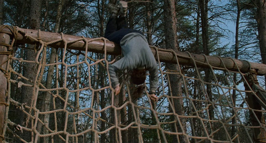 IMAGE: Still - Foster flipping over rope wall